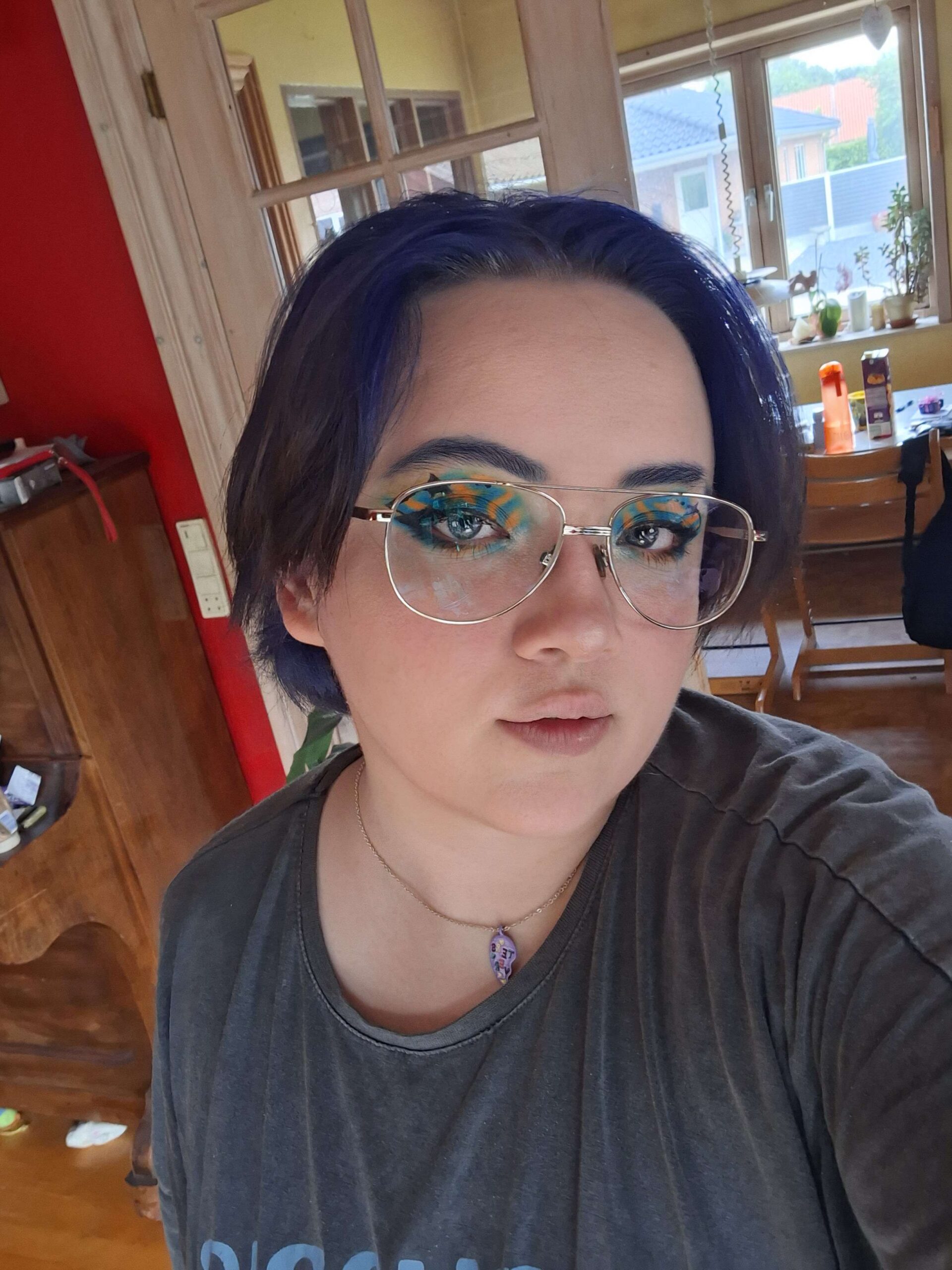 Xenon with blue hair with black tips