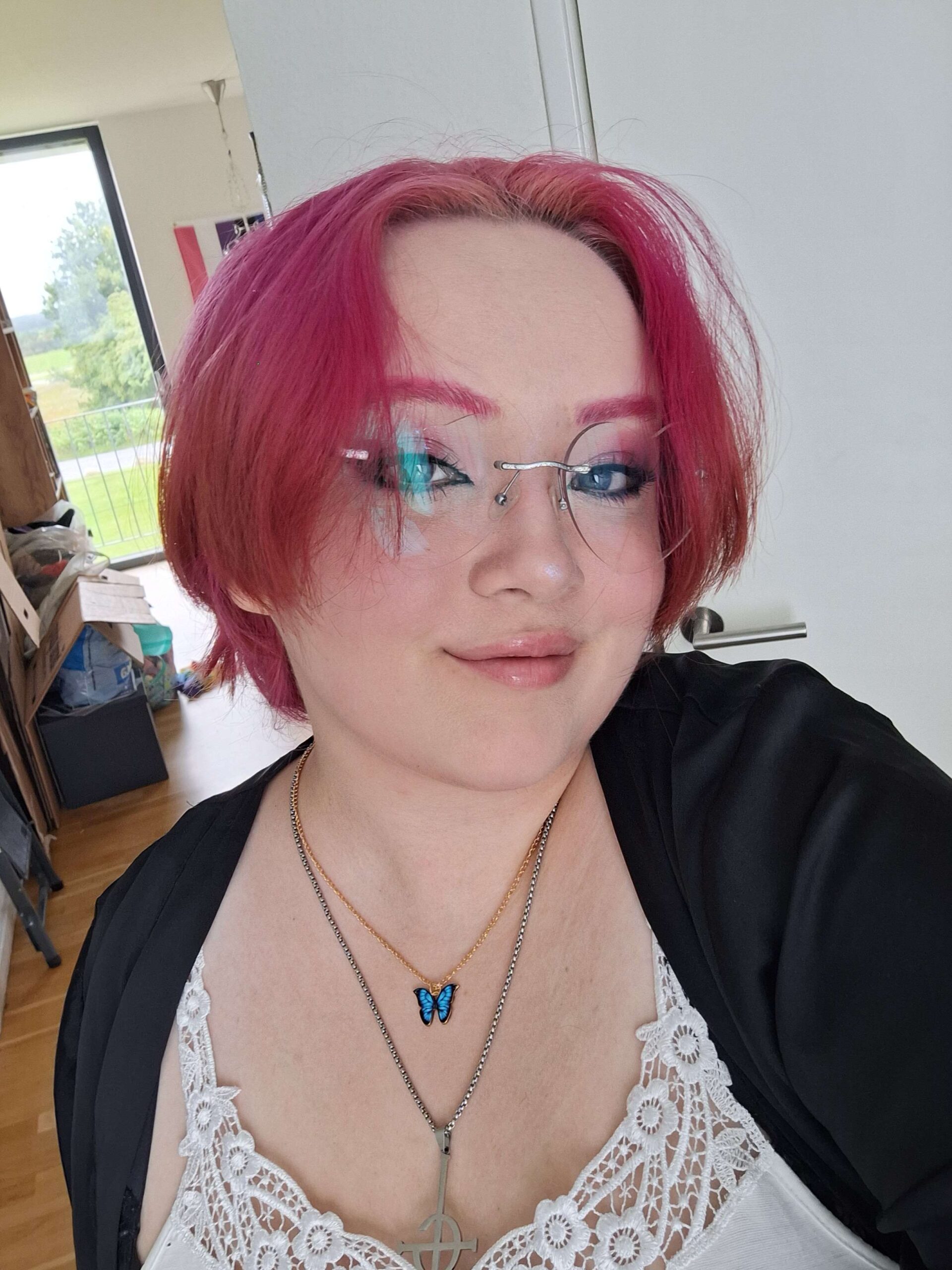 Xenon with pink hair at home