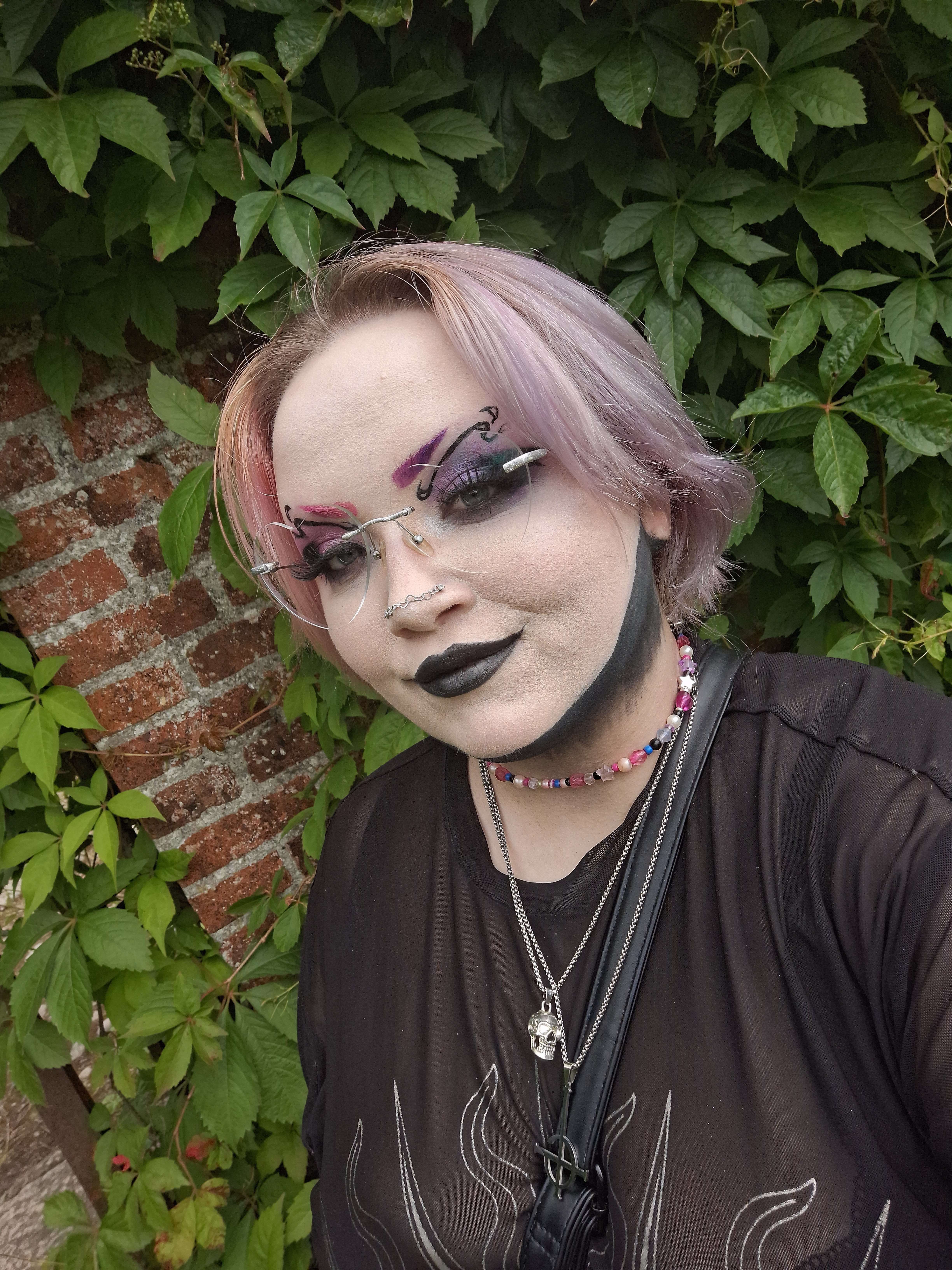 Xenon with split dyed purple and pink hair